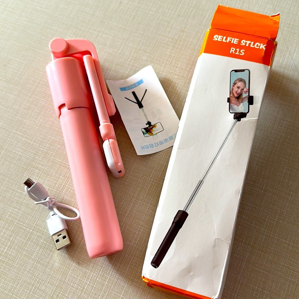 Brand new inbox, baby, pink tripod, and selfie stick with mini light